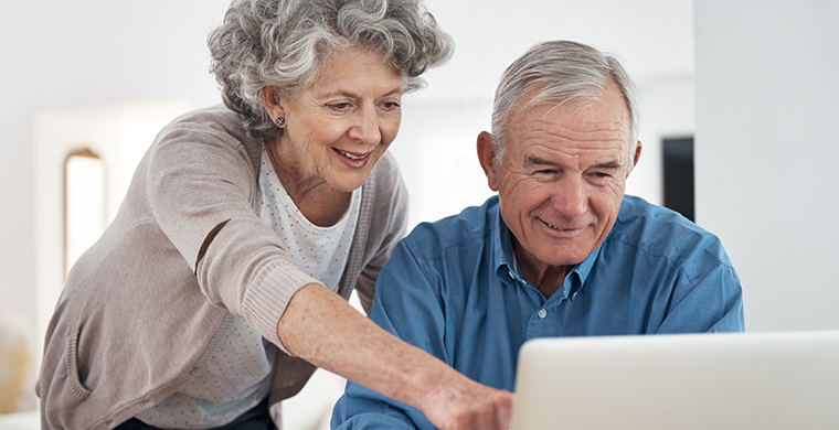 Image of a couple looking at a computer screen